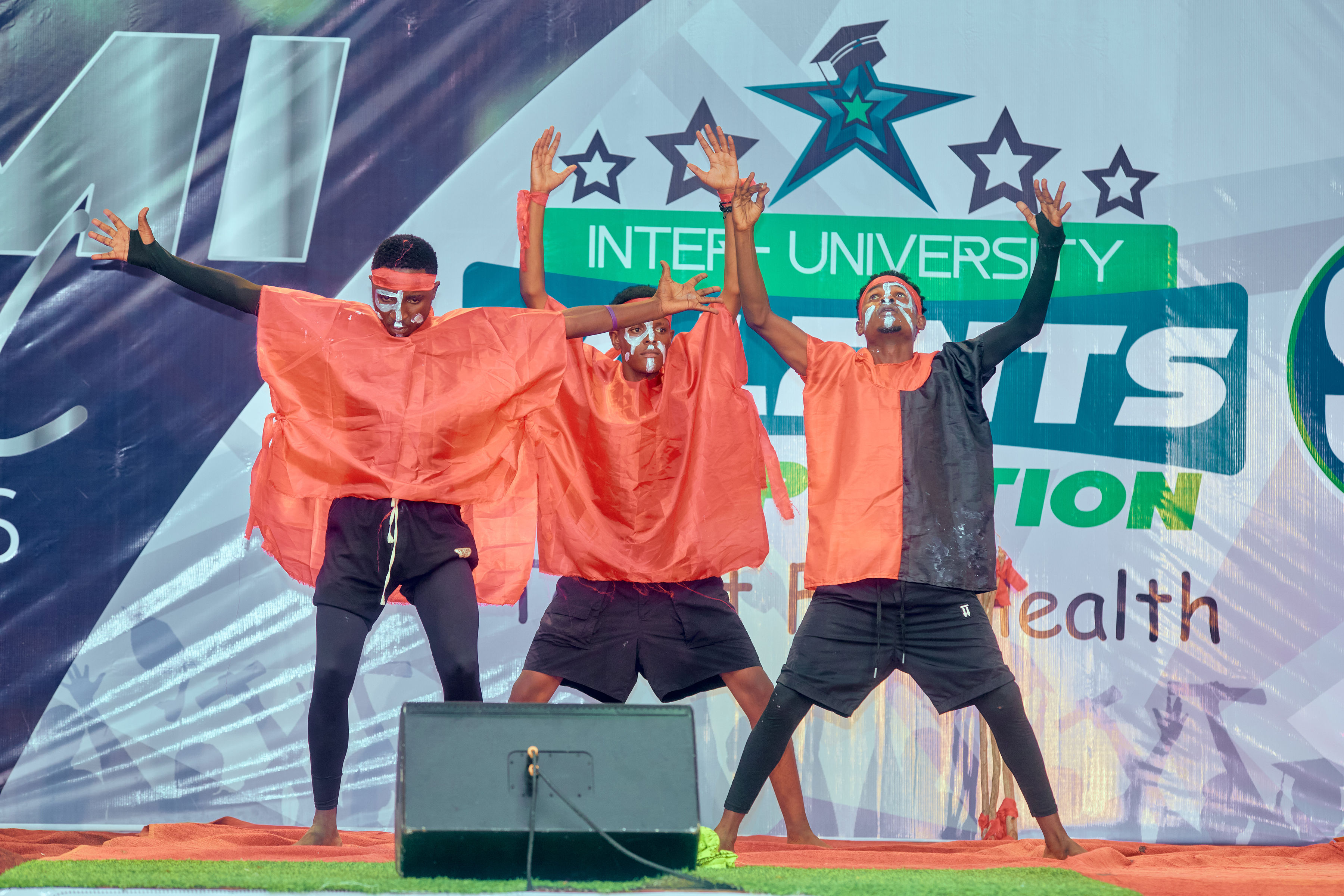 Students performing on stage at an IUTC competition event